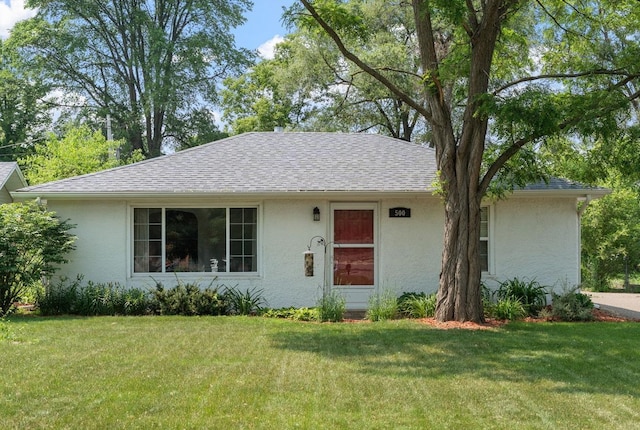500 Cartway Rd, Champlin, MN 55316 - view of front of property with stucco siding, a front yard, and roof with shingles