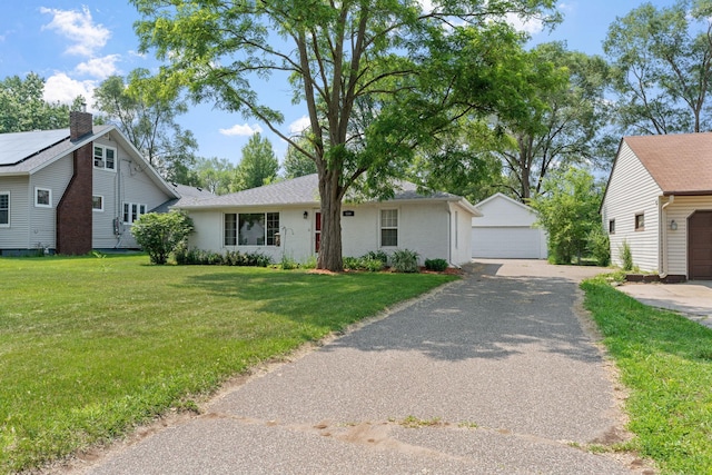 500 Cartway Rd, Champlin, MN 55316 - view of front of home with a detached garage, an outdoor structure, a front lawn, and stucco siding