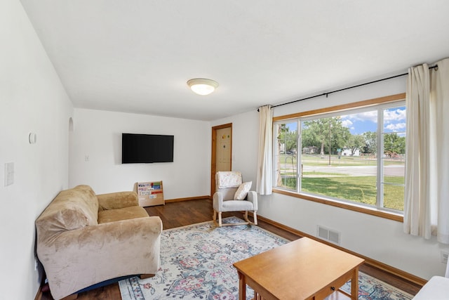 500 Cartway Rd, Champlin, MN 55316 - living area featuring wood finished floors and baseboards