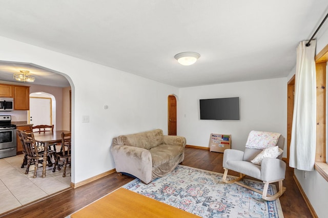 500 Cartway Rd, Champlin, MN 55316 - living room with arched walkways and light wood-type flooring