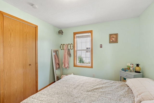 500 Cartway Rd, Champlin, MN 55316 - bedroom with a closet and baseboards