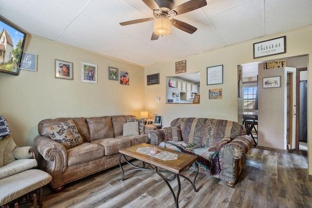 312 5th Ave, Bovey, MN 55709 - living room featuring a ceiling fan and wood finished floors