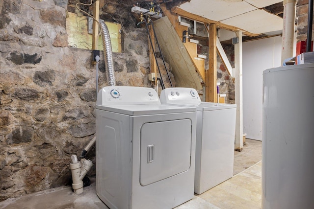 312 5th Ave, Bovey, MN 55709 - laundry room with washing machine and dryer and water heater