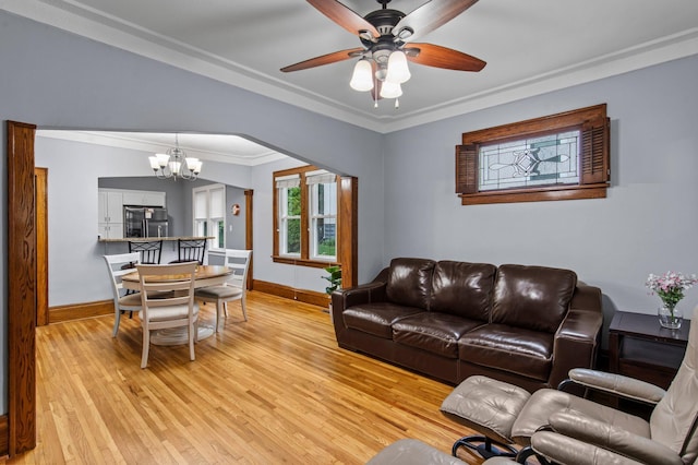 242 Winona St W, West Saint Paul, MN 55118 - living room featuring a chandelier, light wood-type flooring, ornamental molding, and a ceiling fan