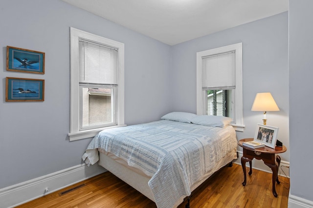 242 Winona St W, West Saint Paul, MN 55118 - bedroom featuring wood finished floors