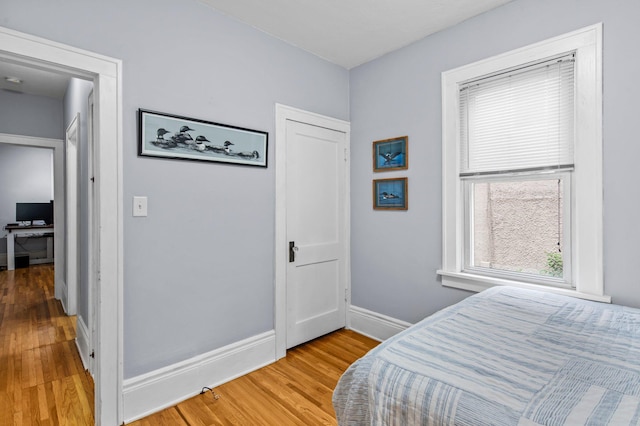 242 Winona St W, West Saint Paul, MN 55118 - bedroom with light wood-type flooring and baseboards