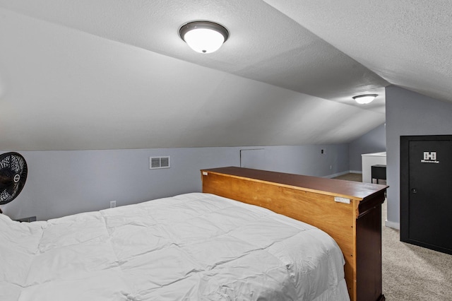 242 Winona St W, West Saint Paul, MN 55118 - bedroom with lofted ceiling, carpet floors, and a textured ceiling