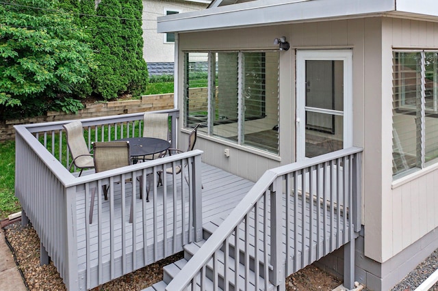 242 Winona St W, West Saint Paul, MN 55118 - wooden deck featuring outdoor dining area and a sunroom