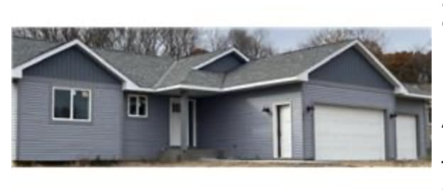 1305 Aspen Dr, Saint Croix Falls, WI 54024 - view of front of property with an attached garage