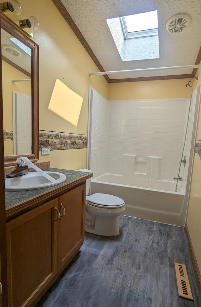 204 6th St W, Carlos, MN 56319 - bathroom featuring shower / bath combination, crown molding, vanity, a skylight, and wood finished floors