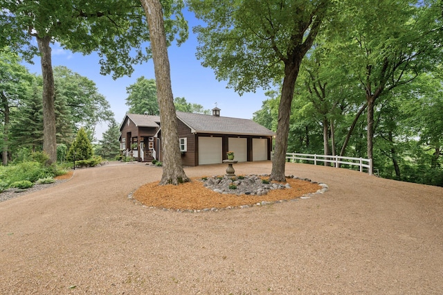 6300 78th Ln, Greenfield, MN 55357 - view of front facade with dirt driveway, a chimney, and a shingled roof