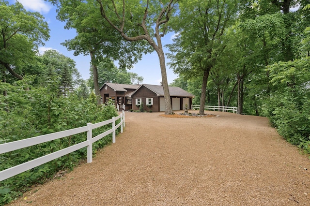 6300 78th Ln, Greenfield, MN 55357 - view of front of home featuring an attached garage and dirt driveway
