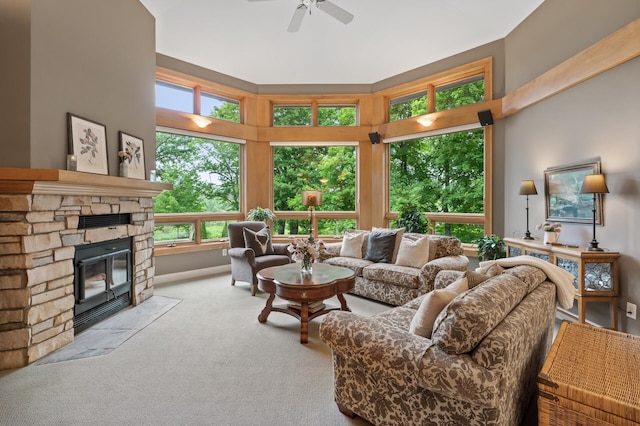 6300 78th Ln, Greenfield, MN 55357 - carpeted living room with ceiling fan, a fireplace, and a high ceiling