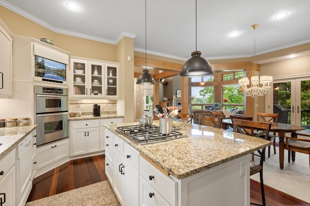 6300 78th Ln, Greenfield, MN 55357 - kitchen featuring stainless steel appliances, dark wood-style flooring, ornamental molding, a breakfast bar, and glass insert cabinets