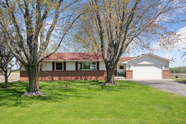 6676 Jason Ave NE, Monticello, MN 55362 - single story home with brick siding, asphalt driveway, a garage, and a front yard