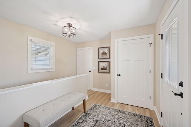 6676 Jason Ave NE, Monticello, MN 55362 - foyer with light wood-style floors and a chandelier