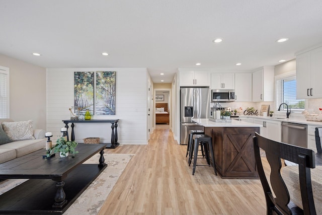6676 Jason Ave NE, Monticello, MN 55362 - living room featuring light wood finished floors and recessed lighting