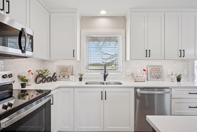 6676 Jason Ave NE, Monticello, MN 55362 - kitchen with stainless steel appliances, light countertops, and white cabinets
