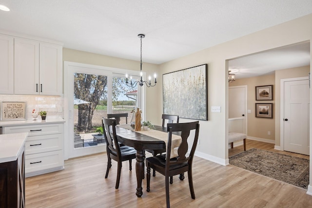 6676 Jason Ave NE, Monticello, MN 55362 - dining area featuring a chandelier and light wood finished floors