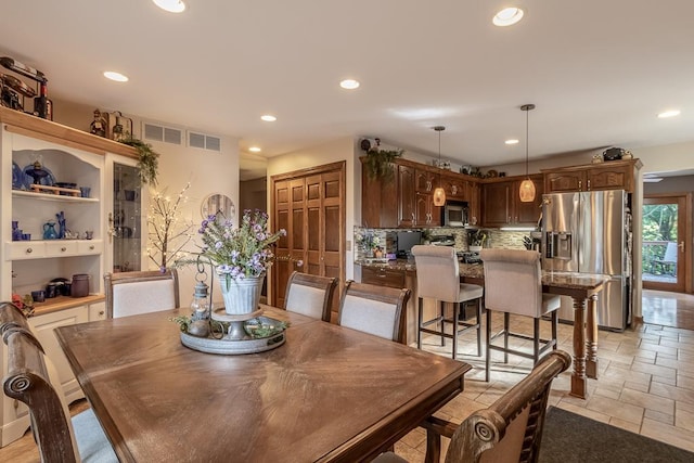 20206 Monks Ave, Mankato, MN 56001 - dining area featuring stone tile floors and recessed lighting