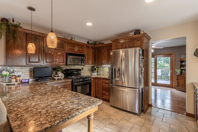 20206 Monks Ave, Mankato, MN 56001 - kitchen with stainless steel appliances, a peninsula, tasteful backsplash, dark stone counters, and ceiling fan