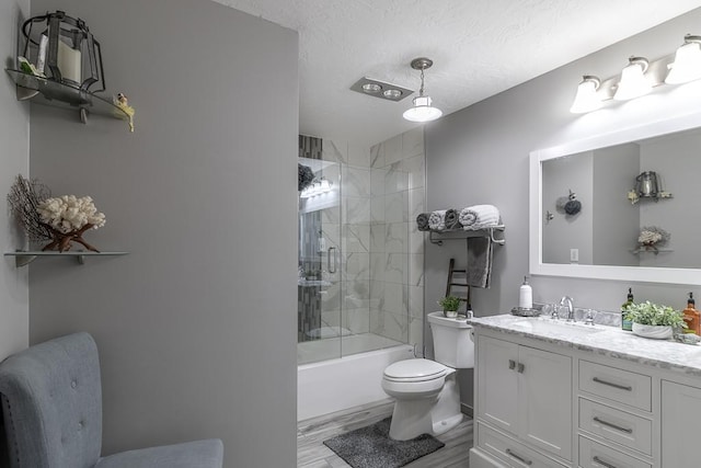 20206 Monks Ave, Mankato, MN 56001 - full bath featuring vanity, wood finished floors, combined bath / shower with glass door, and a textured ceiling