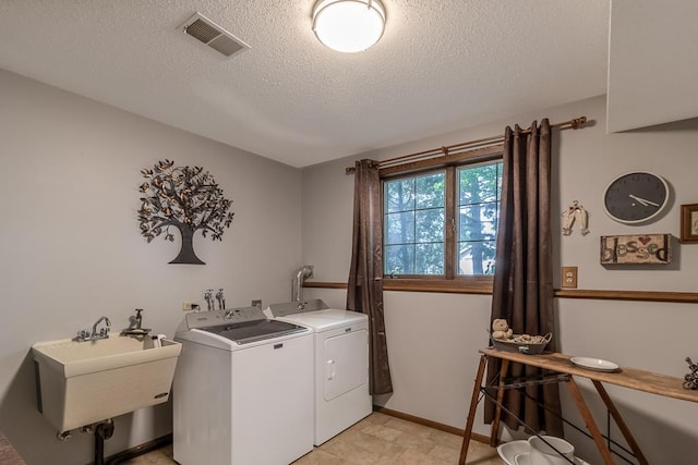 20206 Monks Ave, Mankato, MN 56001 - laundry area featuring washing machine and clothes dryer and a textured ceiling