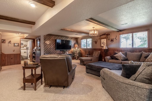 20206 Monks Ave, Mankato, MN 56001 - living area with wooden walls, a textured ceiling, a wainscoted wall, light carpet, and a chandelier
