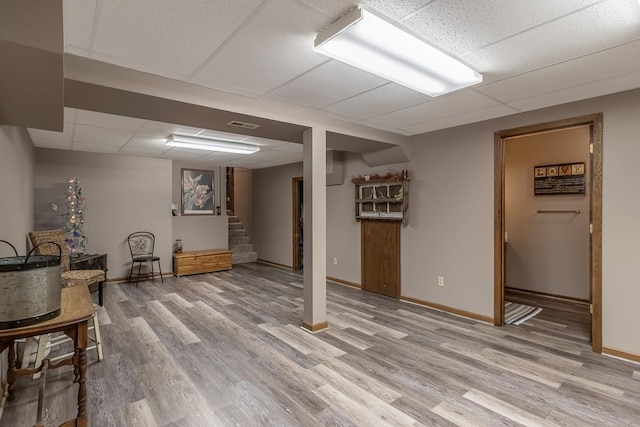 20206 Monks Ave, Mankato, MN 56001 - finished below grade area with a paneled ceiling, light wood-type flooring, and stairway