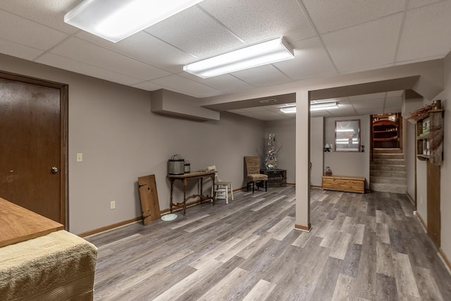 20206 Monks Ave, Mankato, MN 56001 - finished below grade area featuring a drop ceiling, light wood-type flooring, and stairway