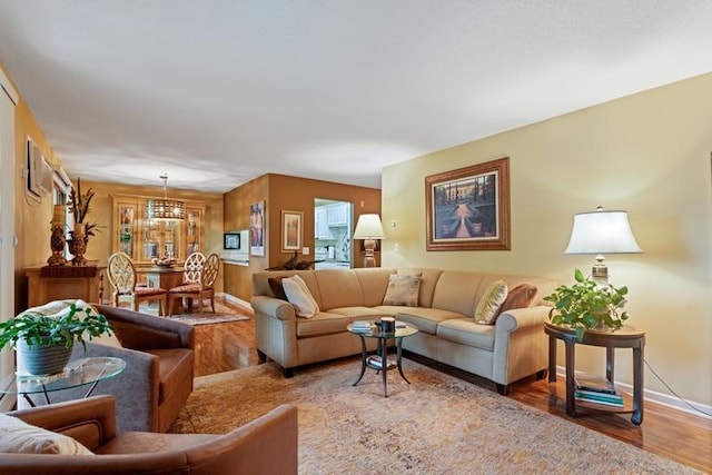 35 Nathan Ln N Unit 104, Plymouth, MN 55441 - living area with a chandelier and wood finished floors