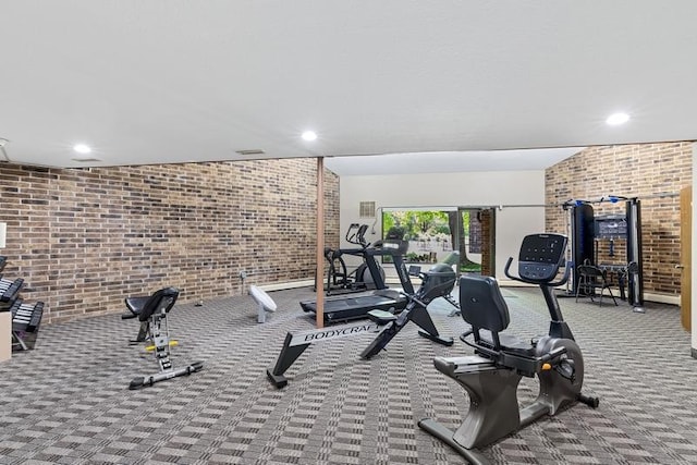 35 Nathan Ln N Unit 104, Plymouth, MN 55441 - gym with brick wall, carpet floors, and recessed lighting