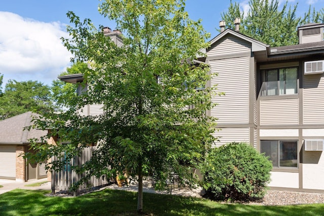 385 Shelard Pkwy Unit 103, Saint Louis Park, MN 55426 - view of home's exterior featuring a chimney