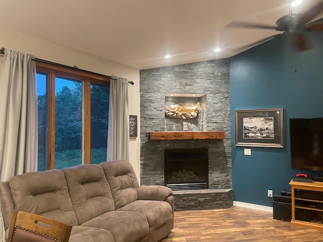 26780 Packard St NE, Athens Twp, MN 55040 - living area with wood finished floors, vaulted ceiling, ceiling fan, and a fireplace