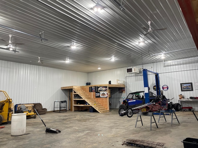 26780 Packard St NE, Athens Twp, MN 55040 - garage featuring a workshop area, a wall mounted air conditioner, and metal wall
