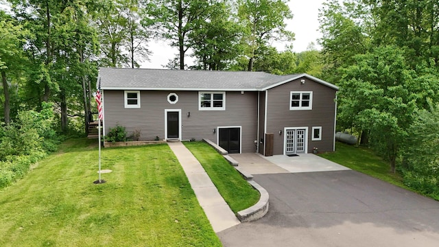 695 Pine Lake Ln, Bone Lake Twp, WI 54837 - raised ranch with a front lawn, driveway, and view of wooded area