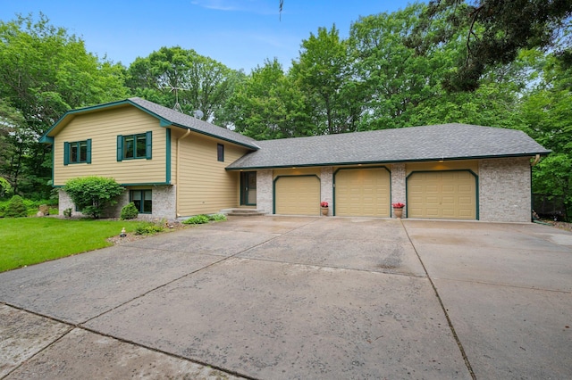 9855 Kadler Ave NE, Otsego, MN 55362 - tri-level home featuring brick siding, a front lawn, an attached garage, and a shingled roof