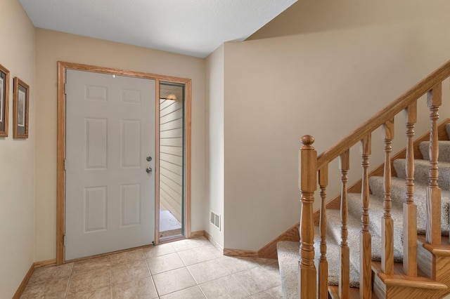9855 Kadler Ave NE, Otsego, MN 55362 - entryway with stairs and light tile patterned flooring