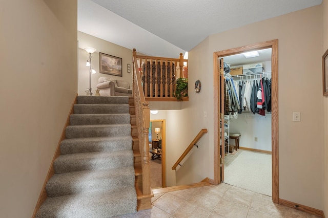 9855 Kadler Ave NE, Otsego, MN 55362 - stairway with tile patterned flooring, carpet flooring, and vaulted ceiling