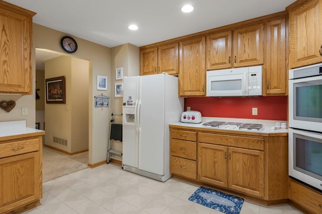 9855 Kadler Ave NE, Otsego, MN 55362 - kitchen with white appliances, light countertops, brown cabinets, recessed lighting, and light floors