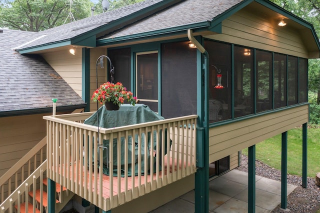 9855 Kadler Ave NE, Otsego, MN 55362 - deck featuring a sunroom, a patio, and stairway