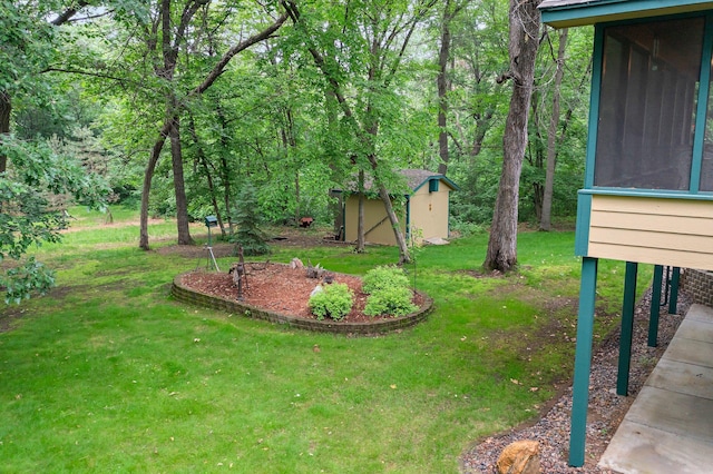 9855 Kadler Ave NE, Otsego, MN 55362 - view of green lawn featuring a storage unit and a sunroom