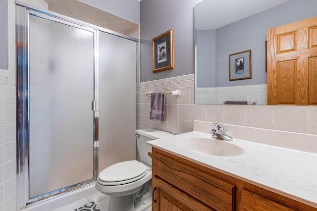 9855 Kadler Ave NE, Otsego, MN 55362 - bathroom featuring vanity, a shower stall, tile patterned flooring, and tile walls