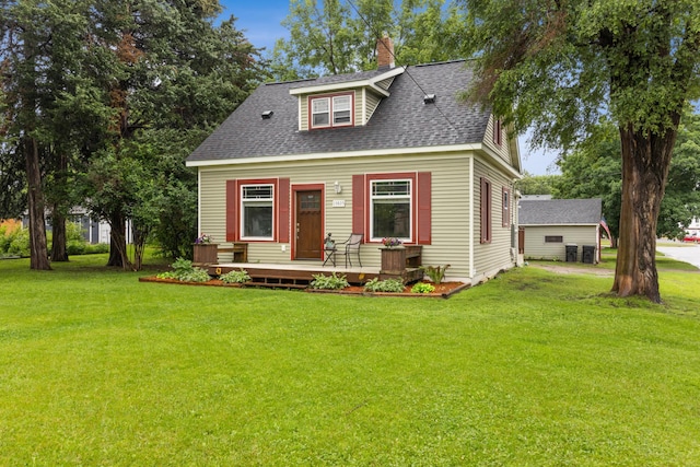13805 Central Ave, Becker, MN 55308 - cape cod house featuring roof with shingles, a front yard, a chimney, and a porch