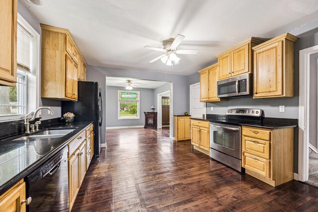 13805 Central Ave, Becker, MN 55308 - kitchen with stainless steel appliances, dark countertops, ceiling fan, dark wood-type flooring, and light brown cabinets