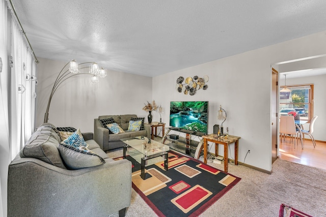 5215 Washburn Ave N, Minneapolis, MN 55430 - carpeted living area featuring a chandelier and a textured ceiling