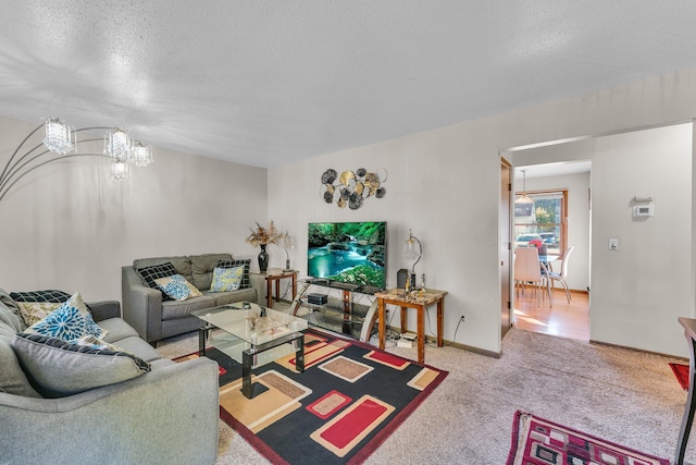 5215 Washburn Ave N, Minneapolis, MN 55430 - living area featuring a textured ceiling, a chandelier, and carpet flooring
