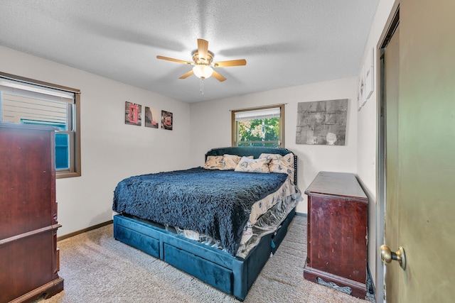 5215 Washburn Ave N, Minneapolis, MN 55430 - bedroom with carpet, a textured ceiling, and a ceiling fan