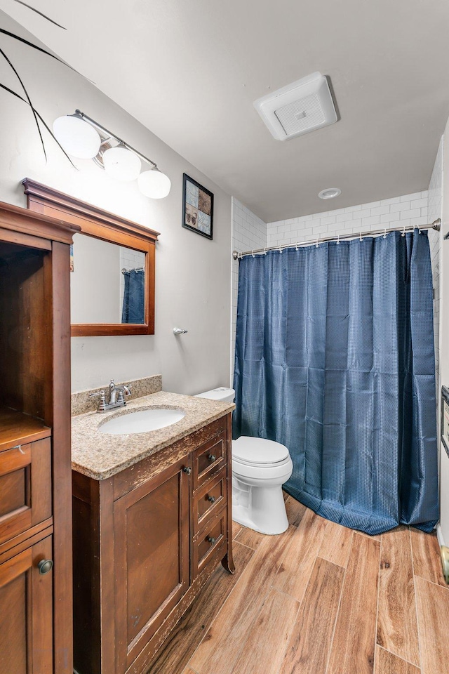 5215 Washburn Ave N, Minneapolis, MN 55430 - full bathroom featuring vanity, wood finished floors, and curtained shower