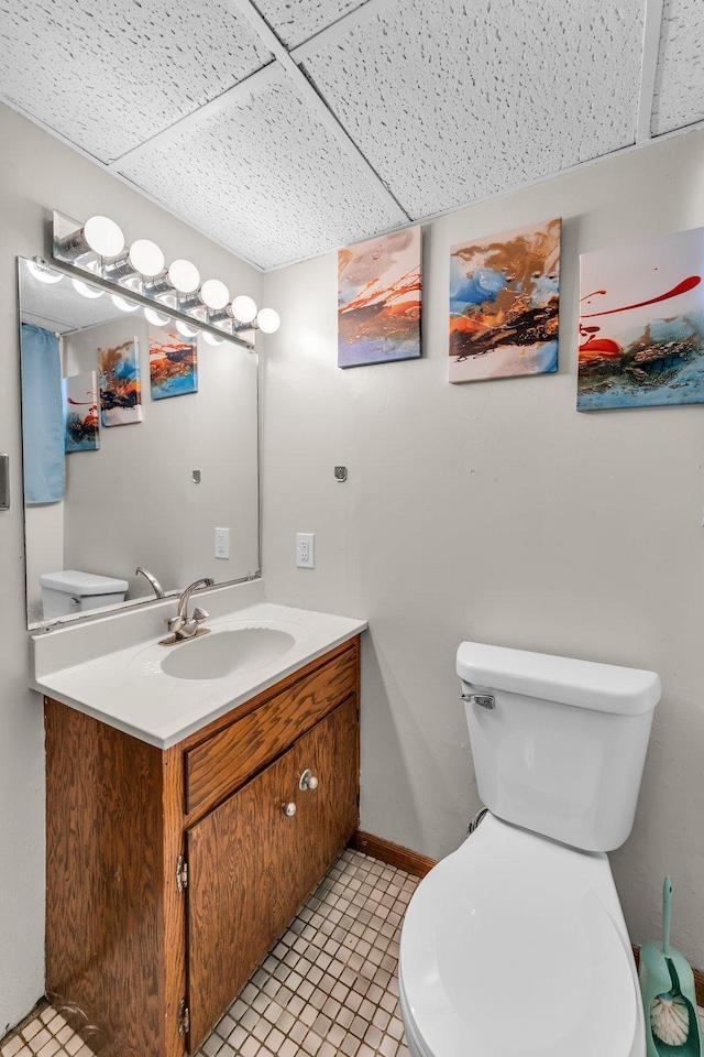 5215 Washburn Ave N, Minneapolis, MN 55430 - half bathroom with vanity and a drop ceiling
